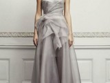 a silver strapless A-line wedding dress with a draped bodice and a fabric bloom on the side plus a small train is very elegant