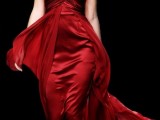 a sheath deep red wedding dress with a draped bodice, a strap on one shoulder and a layered skirt with a train