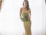 a shiny gold sequin sheath wedding dress wiht a scoop neckline, cap sleeves and a small train is glam and cool