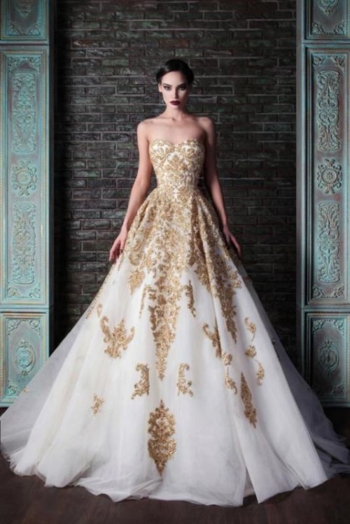 a strapless A-line wedding dress in white with gold embroidery and appliques is an exquisite dress for a formal wedding