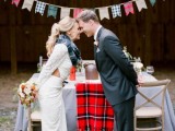 a tartan banner and a chair cover are a stylish idea to decorate a rustic winter wedding or a Christmas one