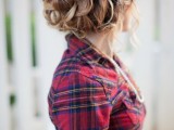 a red tartan shirt over the wedding dress is a stylish casual and cozy idea for a winter wedding