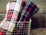 offer plaid blankets to your guests at the wedding to keep them warm and cozy