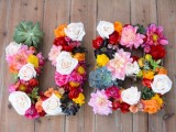 floral monograms done with various bright blooms and some succulents will fit a tropical or just a bright wedding