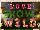 various letters made of marquee lights, moss and blooms will enliven your reception space and make it bolder