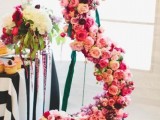 a large monogram done with pink, fuchsia and blush blooms is a chic decoration for a wedding