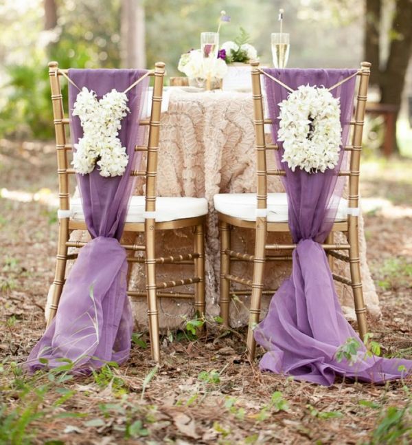 XO letters made of white blooms can be hung on your wedding chairs to mark them right