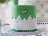 a vintage green wedding cake with sugar lace detailing, a copper crystal and emerald rhinestones for a vintage summer wedding