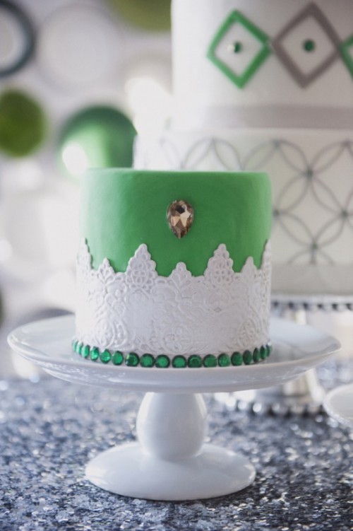 a vintage green wedding cake with sugar lace detailing, a copper crystal and emerald rhinestones for a vintage summer wedding
