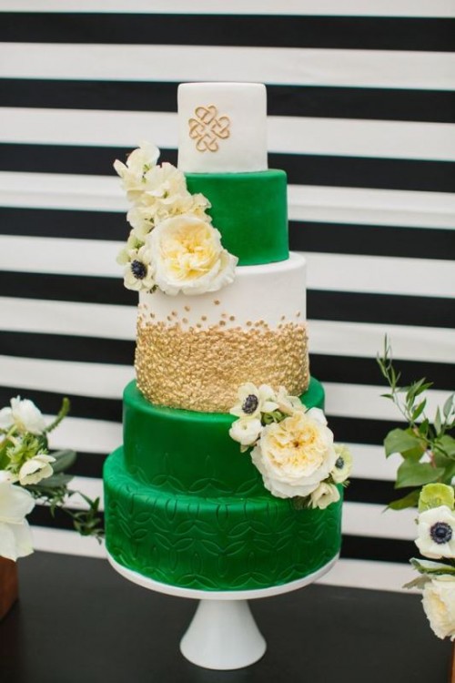 a bright emerald, white and gold wedding cake with gold polka dots, sleek and patterned tiers and white fresh blooms for a bold summer wedding