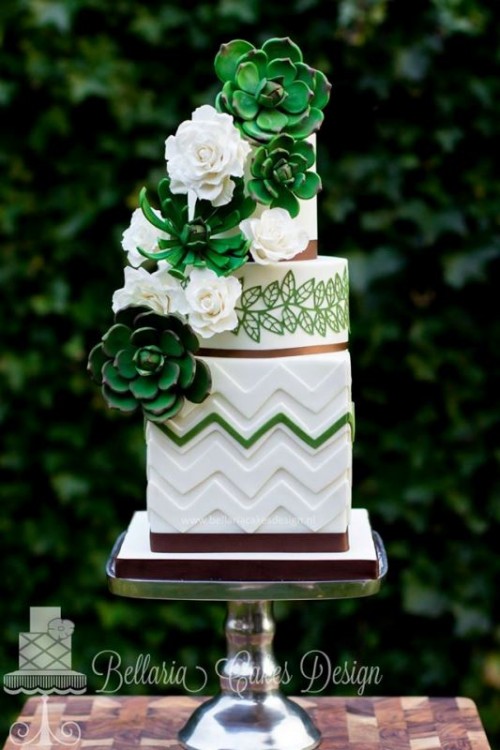 a bold square and round wedding cake with chevron patterns, botanical ones, white natural and green sugar blooms