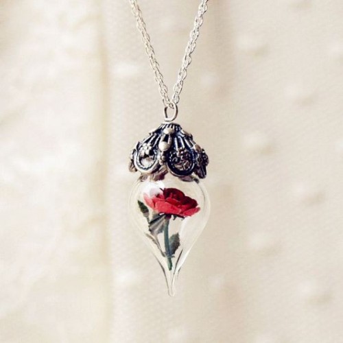 a unique vintage-inspired wedding necklace of a red rose in a jar and some silver and rhinestone cover is a beautiful accessory for a bride or bridesmaids