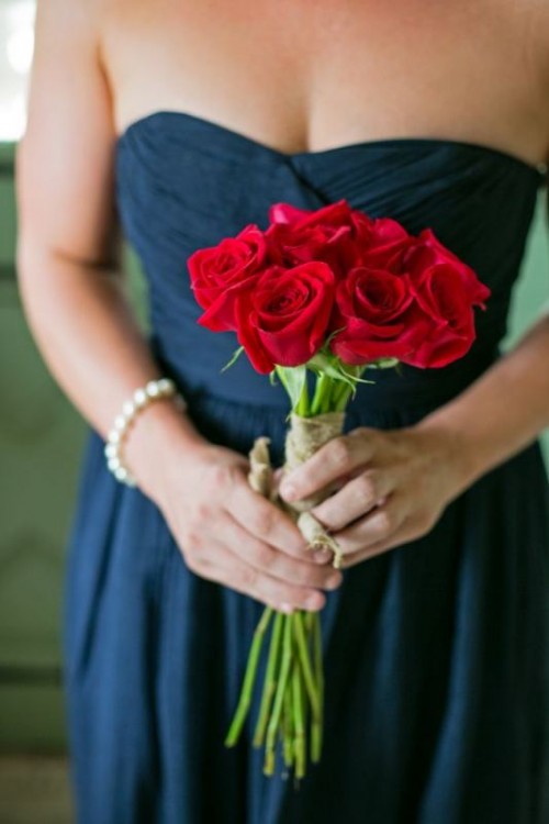 a classic red rose wedding bouquet is a nice idea for both a bride or a bridesmaid, it can be carried for any type of a Valentine's Day wedding