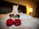 red peep toe shoes topped with fabric red roses will easily fit a vintage-inspired bridal look at her Valentine’s Day wedding