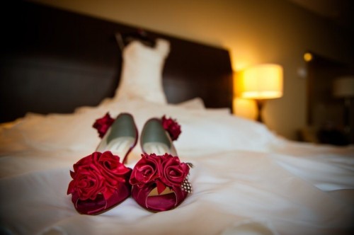 red peep toe shoes topped with fabric red roses will easily fit a vintage-inspired bridal look at her Valentine's Day wedding