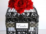 a black cage with red roses and a black lace bow is a lovely box for cards, will fit a vintage Valentine’s Day wedding