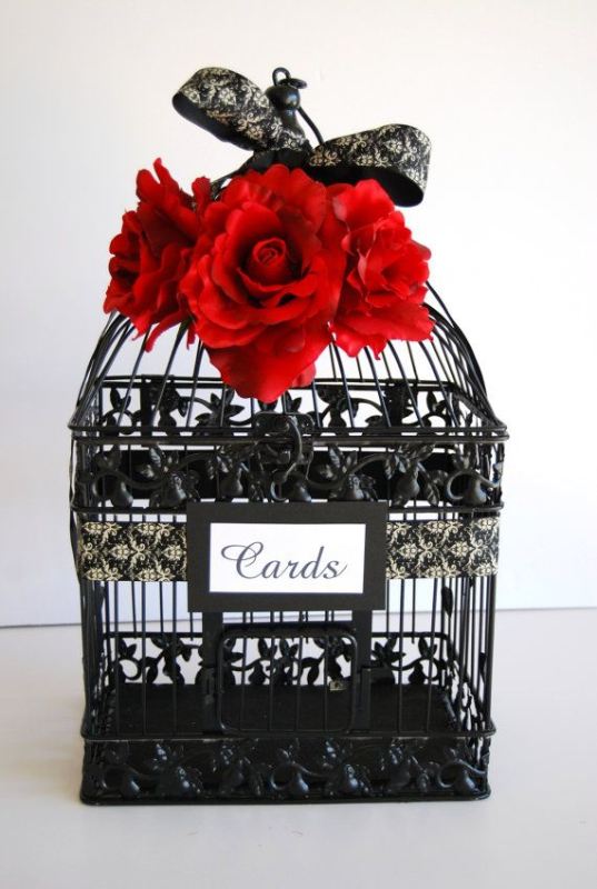 A black cage with red roses and a black lace bow is a lovely box for cards, will fit a vintage Valentine's Day wedding