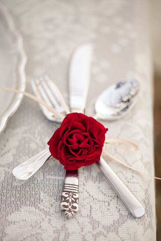 silver cutlery marked with a red rose looks beautiful and very romantic and will finish off your tablescape in the best way possible