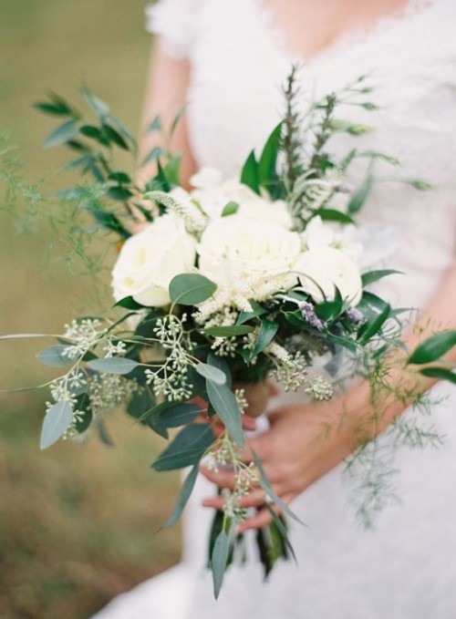 a beautiful organic wedding bouquet of greenery and white blooms is a timeless bridal idea