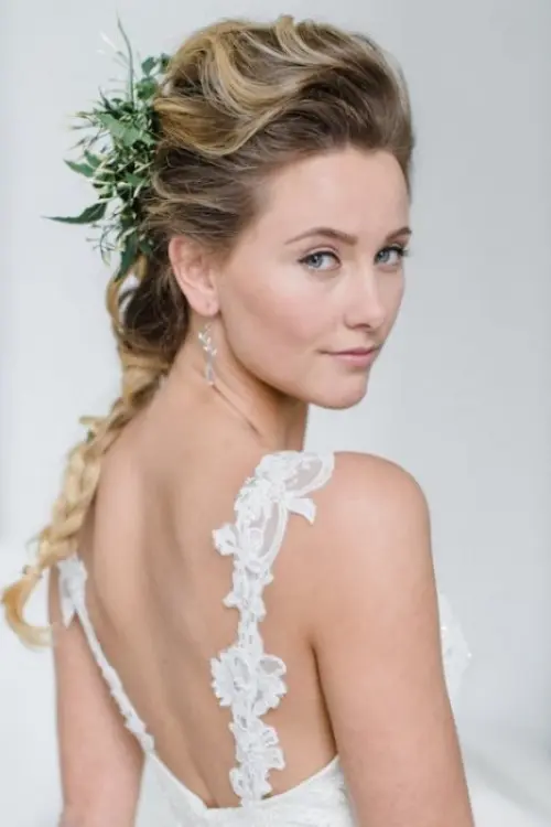 a neutral wedding dress paired with a greenery headpiece is a chic and romantic idea