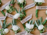 cute boutonnieres of greenery and white blooms are great for grooms and groomsmen