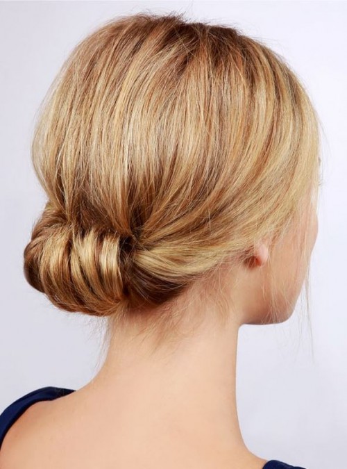 a low updo with a voluminous top is a chic idea for medium length hair