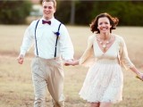 neutral pants, a white shirt, black suspenders and a burgundy bow tie for a chic and simple groom’s look