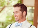 a fresh spring outfit with black thin suspenders, a powder blue bow tie and a white shirt