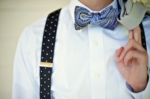 a white shirt, a printed blue bow tie, printed suspenders for a fresh and bold spring groom's look