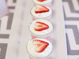delicious trifle desserts topped with strawberry slices are amazign for a summer wedding, serve them together with a wedding cake