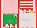 a bright and fun wedding invitation suite in red, white, pink and green, with prints and strawberry lining is amazing for summer