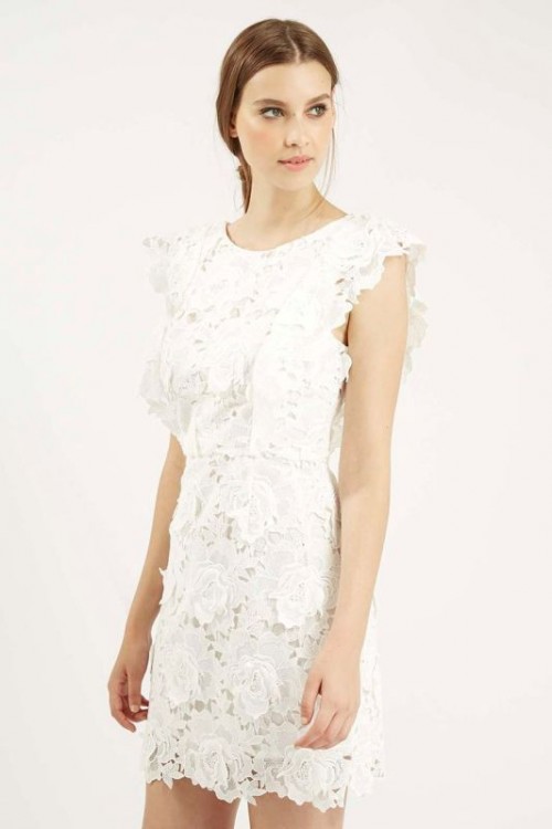 a white lace mini dress with a high neckline, cap sleeves is a chic idea for a modern or girlish bride-to-be