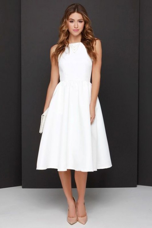 a white sleeveless A-line midi dress of plain fabric, nude heels and a white clutch for a chic modern or minimalist bride-to-be look