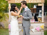 a vintage pallet ice cream stand with signs, with a bright banner is a lovely idea for a vintage or rustic wedding