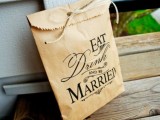 a kraft paper bag with printing and twine is a lovely idea to pack your wedding favors and personalize them a little bit