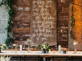 a kraft paper banner and a greenery garland are a lovely idea for a rustic space, they can be a backdrop for your wedding reception or even ceremony and you can DIY them