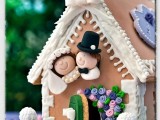 a bright and super fun gingerbread house decorated with various detailing and glazed, with little couple’s figurines is an amazing wedding favor or decor