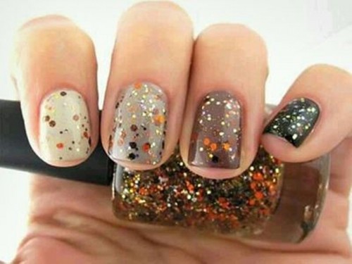 all-different nails in fall colors with colorful sprinkles on them are lovely, cheerful and very fall-like