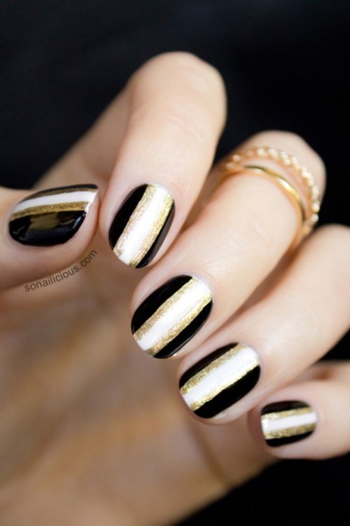 chic art deco nails with black, white and gold glitter stripes are lovely for a romantic bride who loves glam