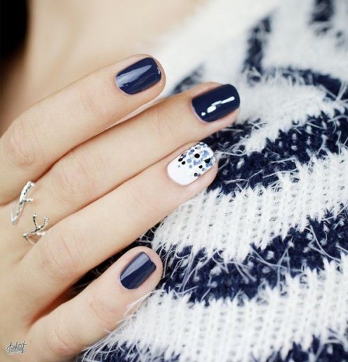 a navy manicure and an accent white and polka dot nail is stylish, chic and bold