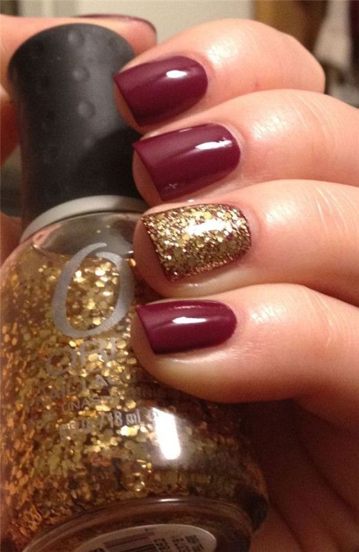 a burgundy manicure with a gold glitter accent nail is classics for a fall bride