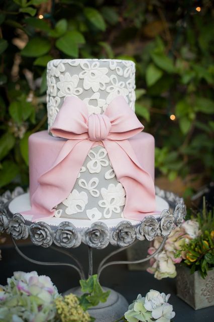 a grey lace wedding cake with a pink sugar bow is a pretty and chic vintage-inspired idea for an elegant wedding, or a tea party wedding