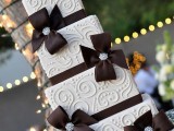 a modern square wedding cake with bows