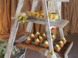 a wedding dessert stand made of a whitewashed ladder is a simple and creative idea that will save some space