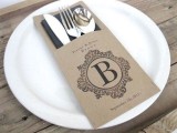 a personalized cardboard pocket with a dark napkin and stylish silver for styling your bbq rehearsal dinner