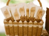 a basket decorated with lace and with wooden cutlery is a great idea for a light bbq rehearsal dinner, eco-friendly and all-natural