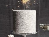 a sparkling silver wedding cake with a sparkler topper is a fantastic idea for a NYE or some other very glam wedding
