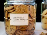 large cookie jars with tags are a proper idea to serve your sweets for many wedding styles