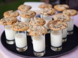 a tray with milk in glasses and chocolate chip cookies that will please everyone