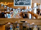 a tiny vintage cookie bar done with an elegant little table and some cookies in jars wiht chalkboard tags